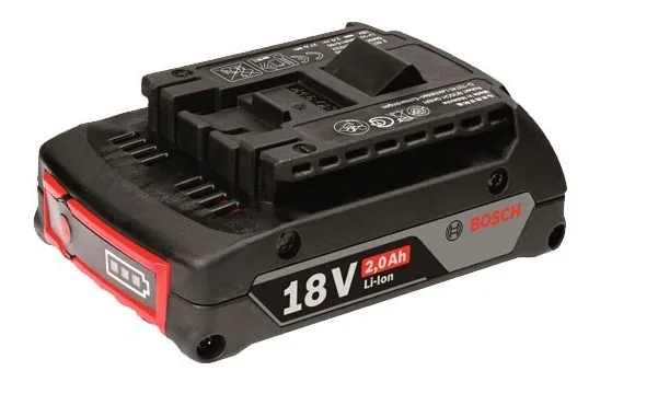 Bộ sạc và pin máy khoan đang được sạc, hướng dẫn cách dùng khoan pin thông qua việc sạc pin đúng cách.