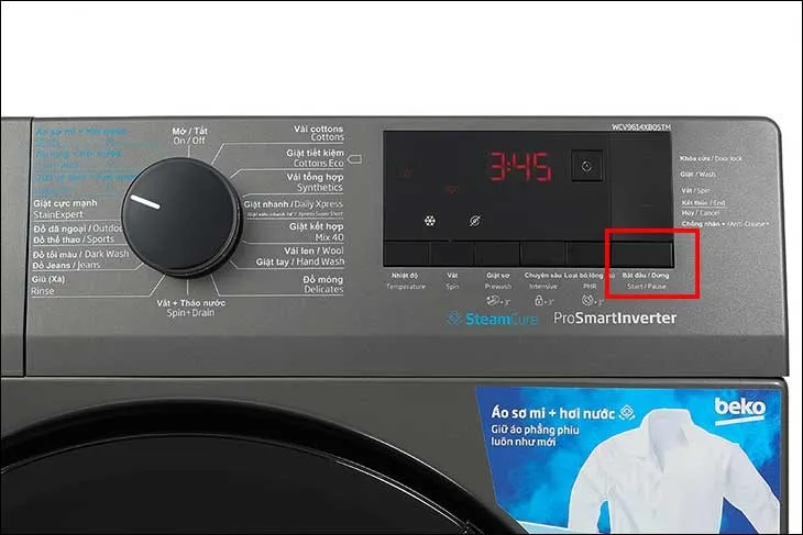 Nút Start/Pause (Bắt đầu/Tạm dừng) trên máy giặt Beko 8kg để khởi động hoặc tạm dừng chu trình giặt