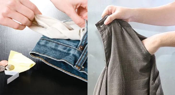 Một bàn tay đang kiểm tra túi quần áo trước khi giặt