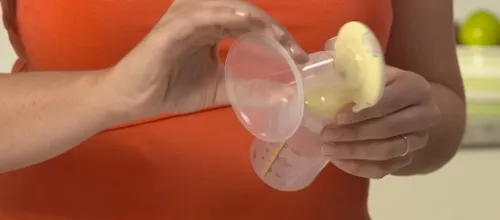 Tháo rời cổ nối, phễu hút và bình sữa của máy Medela Freestyle